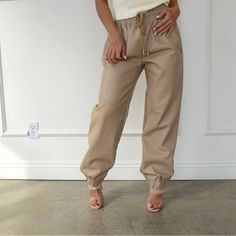 Tan Faux Leather Joggers. Side Pockets, Drawstring Detail, Comfortable Fit. Brand New. Size Large. Tan Faux Leather Joggers Outfit, Casual Beige Faux Leather Bottoms, Cream Joggers, Brown Relaxed Fit Joggers With Pockets, Brown Joggers With Pockets, Beige Cotton Sporty Joggers, Leather Joggers, Tan Pants, Track Pants