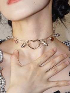 Embrace your Y2K millennial vibes with this edgy yet adorable punk studs heart choker. This choker features a leather subculture design, perfect for adding a touch of punk attitude to your outfit.   Please note that this product includes only the choker. Edgy Choker For Alternative Fashion, Trendy Adjustable Choker For Valentine's Day, Edgy Valentine's Day Gift Choker, Edgy Heart-shaped Choker For Valentine's Day, Trendy Choker For Valentine's Day Party, Trendy Party Choker For Valentine's Day, Trendy Valentine's Day Party Choker, Edgy Choker Jewelry For Valentine's Day, Edgy Choker For Valentine's Day