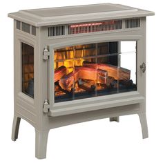 an electric stove with logs in it and flames coming from the front door, on a white background