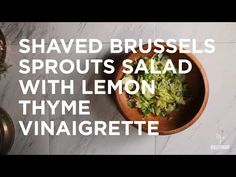 shaved brussels sprouts salad with lemon thye vinaigrete in a bowl