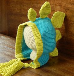 a crocheted stuffed animal sitting on top of a wooden table