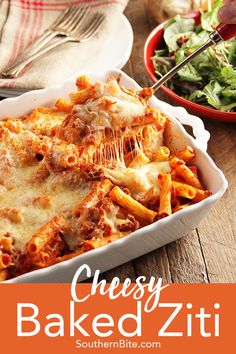 cheesy baked ziti in a casserole dish on a wooden table