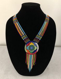 This Beadwork range is available in a wide variety of color combinations. The more traditional bright opaque colors ie: blue, red, yellow, turquoise, white, orange, green, lime, etc. Unless otherwise requested you will receive a mixture of colors and sizes. Our products are handcrafted and sizes are an average. The color, design, and size may vary slightly. Artisan Multicolor Adjustable Beaded Necklaces, Adjustable Multicolor Artisan Beaded Necklaces, Multicolor Beaded Round Beads Jewelry, Artisan Multicolor Beaded Necklaces, Artisan Multicolor Beaded Chain Necklace, Traditional Multicolor Beaded Necklaces As Gift, Traditional Handmade Multicolor Beaded Necklaces, Artisan Multicolor Beads, Traditional Multicolor Beaded Chain