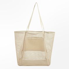 Embrace the carefree spirit of summer with our Breezy Mesh Beach Tote. Designed to be your stylish companion for sun-soaked days, this tote effortlessly combines fashion and functionality. Crafted from lightweight mesh material in a versatile neutral hue, it offers a breathable and airy feel, perfect for carrying your beach essentials while keeping everything sand-free. Product code: CAC12F4E003GG Trendy Rectangular Mesh Bag, Trendy Rectangular Mesh Bags, Trendy Mesh Bag For Daily Use, Summer Cream Beach Bag For Daily Use, Chic Lightweight Summer Bag, Versatile Large Capacity Beach Bag For Summer, Cream Beach Bag For Daily Use, Trendy Cream Beach Bag For Beach Season, Summer Mesh Rectangular Shoulder Bag