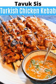 chicken kebabs on skewers served with tomato sauce