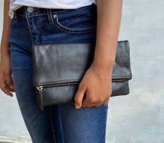 This clutch is a perfect day bag. Made for simplicity, this classic leather clutch brings timeless elegance to your style. Made of genuine leather, this clutch goes with all seasons and occasions.  SPECIFICATIONS ♥ Photo shown is size L ♥ Size     L (shown) : 33 x 18 cm / 12.9 x  7 inch (folded) & 33 x 30 cm / 12.9 x  11.8 inch (unfolded)     S : 26 x 16 cm / 10.2 x 6.9 inch (folded) & 26 x 26 cm / 10.2 x 10.2 inch (unfolded)  ♥ Material : genuine leather ♥ YKK zipper  ♥ Zippered inside pocket for phone.  ♥ Suede fabric lining  ♥ Color : Tan (Please note that color shade varies from one material and another and there is no exact same piece) BULK ORDER We accept bulk orders for our clutches. We give 15% off for a minimum of 10 items for the clutch. Please leave me a message if you want to o Classic Everyday Crossbody Clutch, Versatile Leather Clutch With Fold Over Clasp, Minimalist Leather Clutch For Everyday Use, Versatile Leather Clutch With Smooth Grain, Everyday Crossbody Clutch With Fold Over Clasp, Everyday Rectangular Clutch With Fold Over Clasp, Classic Soft Leather Crossbody Clutch, Everyday Soft Leather Clutch Wallet, Leather Envelope Clutch For Everyday Use