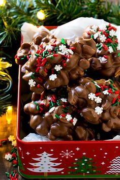 a red tin filled with chocolate covered pretzels