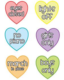 four heart shaped stickers with words on them