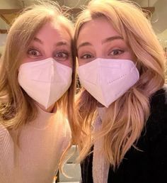 two women wearing face masks to protect them from the corona pandemic dusts