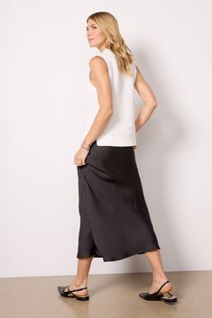 Crafted in sleek satin fabric, the Maddie skirt by EVEREVE is a chic day-to-night staple, featuring a midi silhouette with a hidden elastic waistband. You'll love it paired with everything from a sweater and flats to a fitted tank and heels. | EVEREVE Women's Maddie Satin Skirt, Size XL, Black Chic Satin Maxi Skirt For Work, Chic Midi Length Viscose Skirt, Sleek Spring Midi-length Bottoms, Brand Style Guide, Fashion 101, Satin Skirt, Polyester Satin, Fall Shopping, Tee Dress