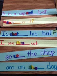 four books with words written on them sitting next to each other in front of a wooden table