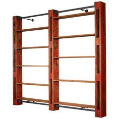 a wooden book shelf with metal bars on it