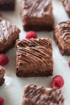 chocolate brownies with raspberries on the side