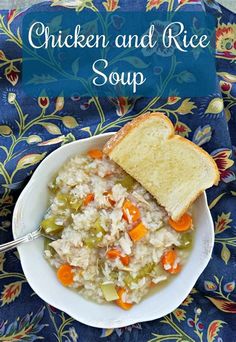 chicken and rice soup in a white bowl with a slice of bread on the side