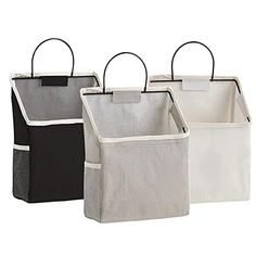 three storage bags with handles on each side and two different colors, one black, one white