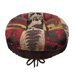 a brown and red round cushion with an animal print on it's side, tied to a black cord