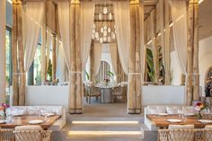 the inside of a restaurant with tables and chairs