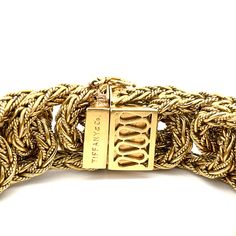 Estate Tiffany & Co. Vintage Braided Link Bracelet in 18K Yellow Gold. This rare bracelet features a hidden claps with a figure eight safety latch, is 7 3/8" long, 7/8" wide, and weighs 147.4 grams. Signed Tiffany & Co. 750 Italy and additional hallmarks. Tiffany Lock Gold Bracelet, Buying Gifts, Tiffany & Co., Earring Necklace, Ring Necklace, Link Bracelets, Precious Metals, Custom Jewelry, Brooch Pin