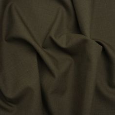 a close up view of a dark green fabric