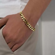 Miami Cuban Bracelet Gold is coated with 14k gold which makes it a perfect addition to anyone's bracelet collection. You can layer multiple bracelets for a cool look that enhances the style of your casual and formal outfits. This bracelet is comfortable to wear on a daily basis and has a metal clasp making for an easy getting on/off. You can get this piece as a perfect present for your homie on a special occasion or as a surprise gift. We know you’ll never want to take your Caligio bracelets off Trendy Gold Bracelet Strap Jewelry, Trendy Gold Bracelet Jewelry, Trendy Gold Jewelry With Bracelet Strap, Gold Jubilee Bracelet For Everyday Wear, Gold Cuban Link Bracelet With Metal Strap, Adjustable Yellow Gold Cuban Link Bracelet, Gold Metal Bracelet Wristband, Gold Metal Wristband Bracelet, Gold Minimalist Chain Bracelet