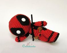 two crocheted red and black baby shoes