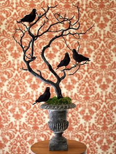 a tree with birds sitting on it in front of a wallpapered background and an instagram post about petunia sharp fine art