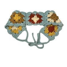 a crocheted headband with flowers on it