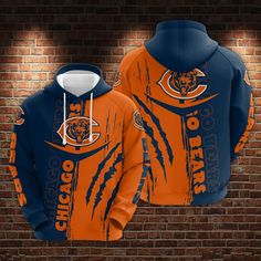 an orange and blue chicago bears hoodie on a brick wall