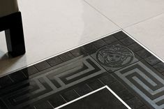 a tile floor with a design on it