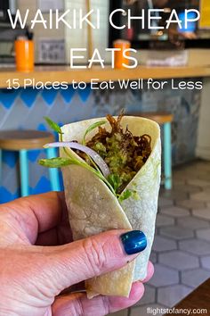 a hand holding a wrap filled with food and text overlay reads waiki cheap eats 15 places to eat well for less