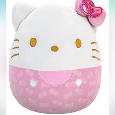 a hello kitty stuffed animal with a pink bow on it's head and eyes