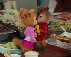 the chipmuns are getting ready to eat some food at the buffet table together