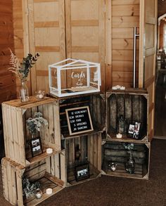 three wooden crates are stacked on top of each other in front of a wood wall