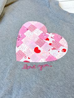 a patchwork heart on a gray shirt