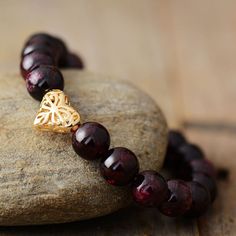 Garnet Stone Bracelet Our Handmade Garnet Stone Bracelet is a harmonious blend of elegance and metaphysical allure. These unique bracelets are not just accessories; they are a symbol of craftsmanship, designed to bring protection and health into your life. Garnet: A Gem of Profound Significance This gemstone, often associated with love and loyalty, carries a rich history and a wealth of healing properties that make it a favorite among gemstone enthusiasts. Each of our Garnet bracelets is handmad Garnet Bead Bracelet, Love And Loyalty, Sea Opal, Garnet Heart, Elastic Rope, Garnet Bracelet, Natural Stone Bracelets, Garnet Stone, Unique Bracelets