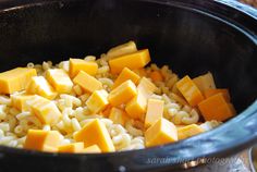 a bowl filled with rice and cheese on top of a table