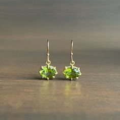 Juicy peridots twinkle and flash within their delectable gold prongs.

18k yellow gold, 14k ear wires 
Peridot 8mm x 6mm (5/16" x 1/4")
Earrings hang 3/4" from the ear 
Each earring weighs 0.8g 4 Earrings, Peridot Earrings, Gift Card Shop