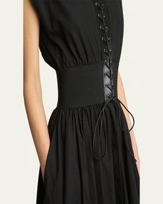 ALAIA belted midi dress features a laceup front styling and a belted waist     Round neckline    Sleeveless    Hem falls below the knee    Aline silhouette     Cotton/leather/elastane    Lining: Nylon/elastane    Made in Italy Spring Evening Corset Belt, Luxury Black Belted Dress, Chic Belted Corset Belt For Spring, Elegant Spring Corset Belt, Black Spring Dress With Belt Detail, Black Belted Dress For Spring, Spring Black Dress With Belt Detail, Spring Black Belted Corset Belt, Fitted Black Belted Dress For Summer