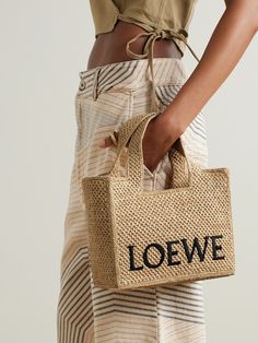 Designed in collaboration with Paula's Ibiza, Loewe's tote is woven from raffia and embroidered with the house moniker. Topped with two handles that feel comfortable to carry, it has plenty of space inside for vacation essentials, like a paperback and sunglasses. Patterns Outfit, Easy Crochet Bag, Loewe Paula's Ibiza, Vacation Essentials, Loewe Bag, Flat Dress Shoes, Woven Tote Bag, Raffia Bag, Crochet Bags