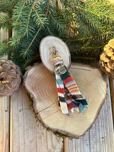 a pair of multicolored knitted socks sitting on top of a piece of wood