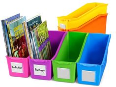 the colorful bins are holding books and folders for each child to use in their classroom