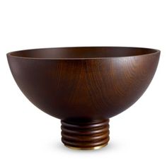 a large wooden bowl sitting on top of a table