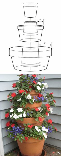 several potted flowers are stacked on top of each other in front of a house