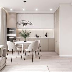 a living room filled with furniture and a dining table next to a kitchen counter top