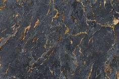 black marble with gold veining on it