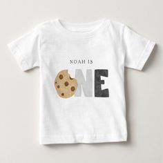 a white shirt with a cookie on it that says noah is one