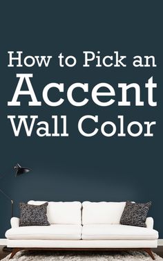 a white couch sitting in front of a blue wall with the words how to pick an accent wall color