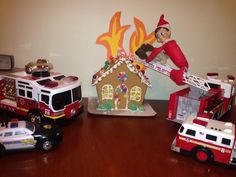 there are many toy firetrucks on the table