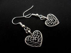 This is a pair of pretty little tibetan silver heart themed earrings. Measure approx. 3cm long. With silver plated hooks and findings. Thanks for looking!! Handmade Silver Heart Drop Earrings, Silver Double Heart Cute Earrings, Cute Double Heart Silver Earrings, Heart Themed, Gothic Accessories, Dangly Earrings, Silver Heart, Alex And Ani Charm Bracelet, My Jewellery