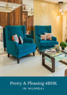 a living room filled with blue chairs and a glass table in front of a mirror